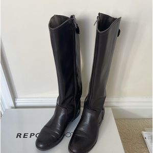 Report Brown tall “riding” boots with brass snaps , zipper up back size 8